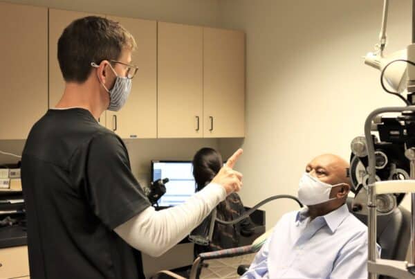 Dr. Forche performing exam with a older gentleman